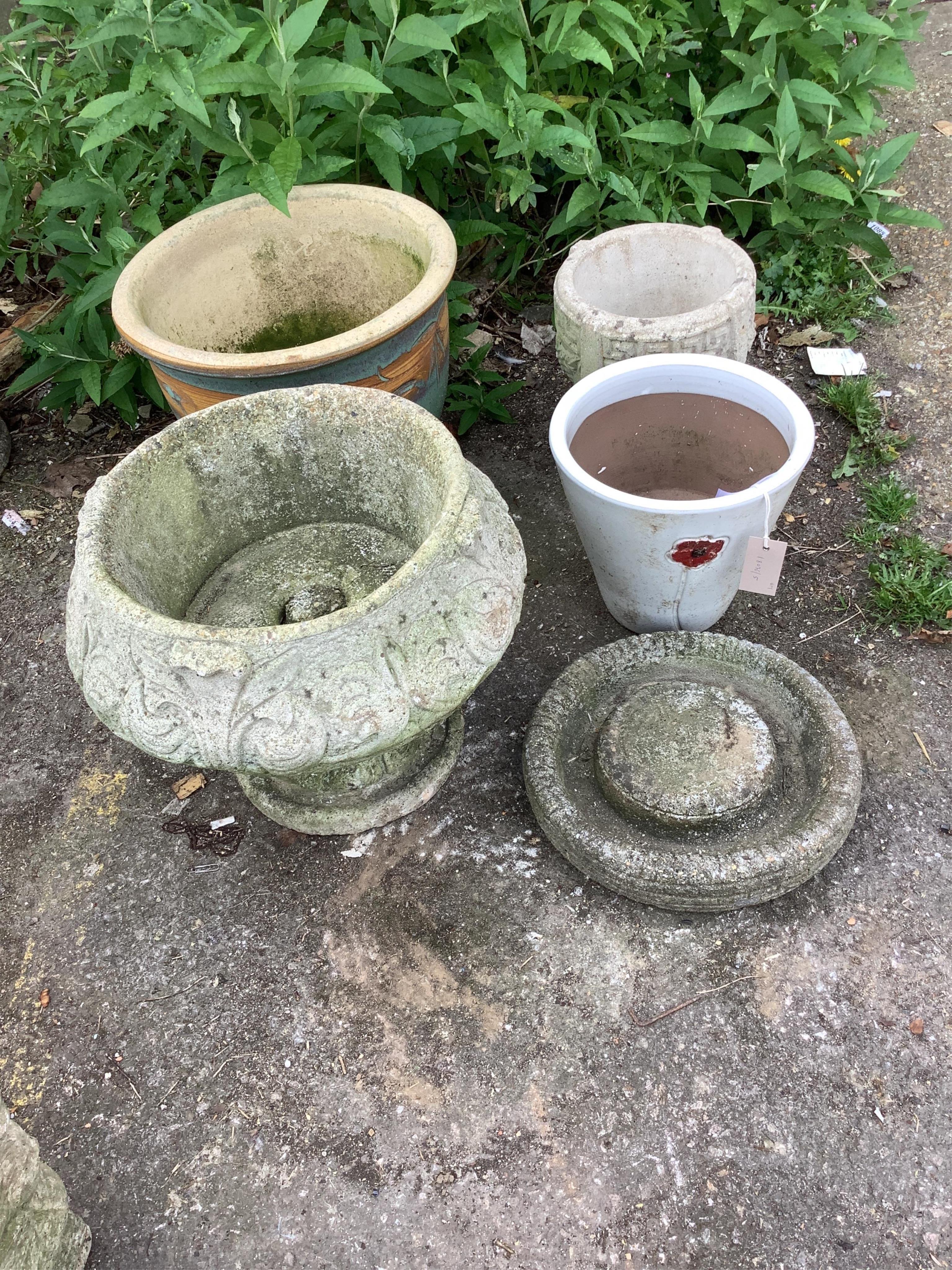 Six assorted stone and earthenware garden planters and a bird bath, largest diameter 38cm, height 32cm